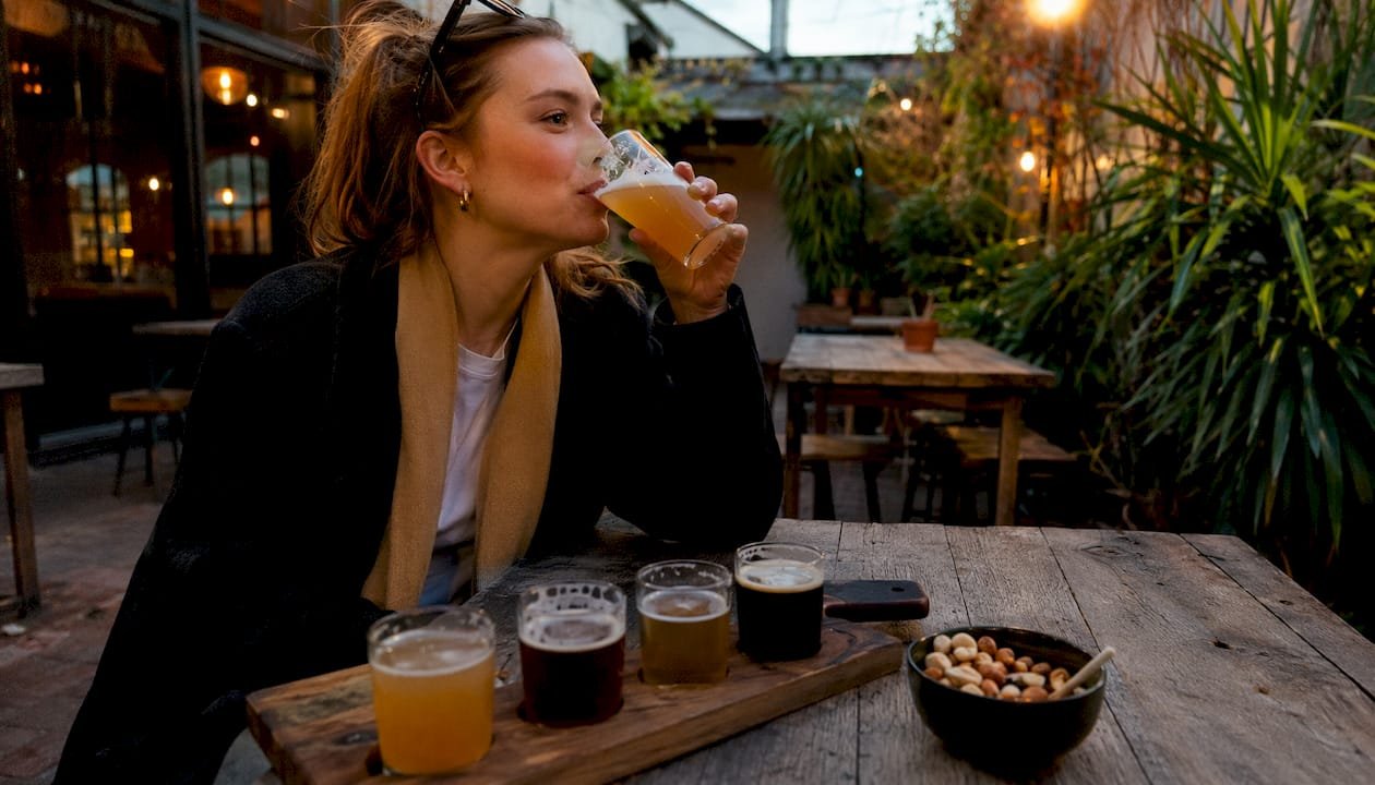 Woman tasting gluten-free beer in Brighton taproom