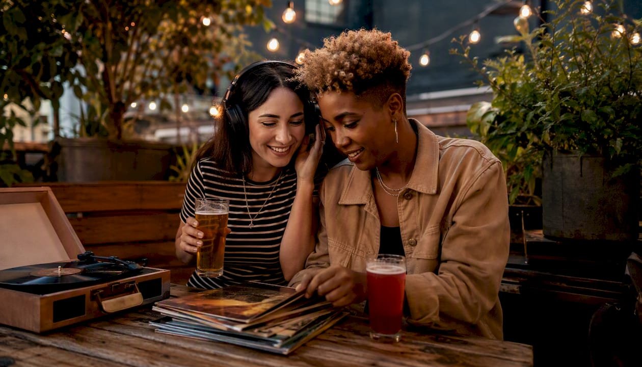 Couple enjoying vinyl records in taproom