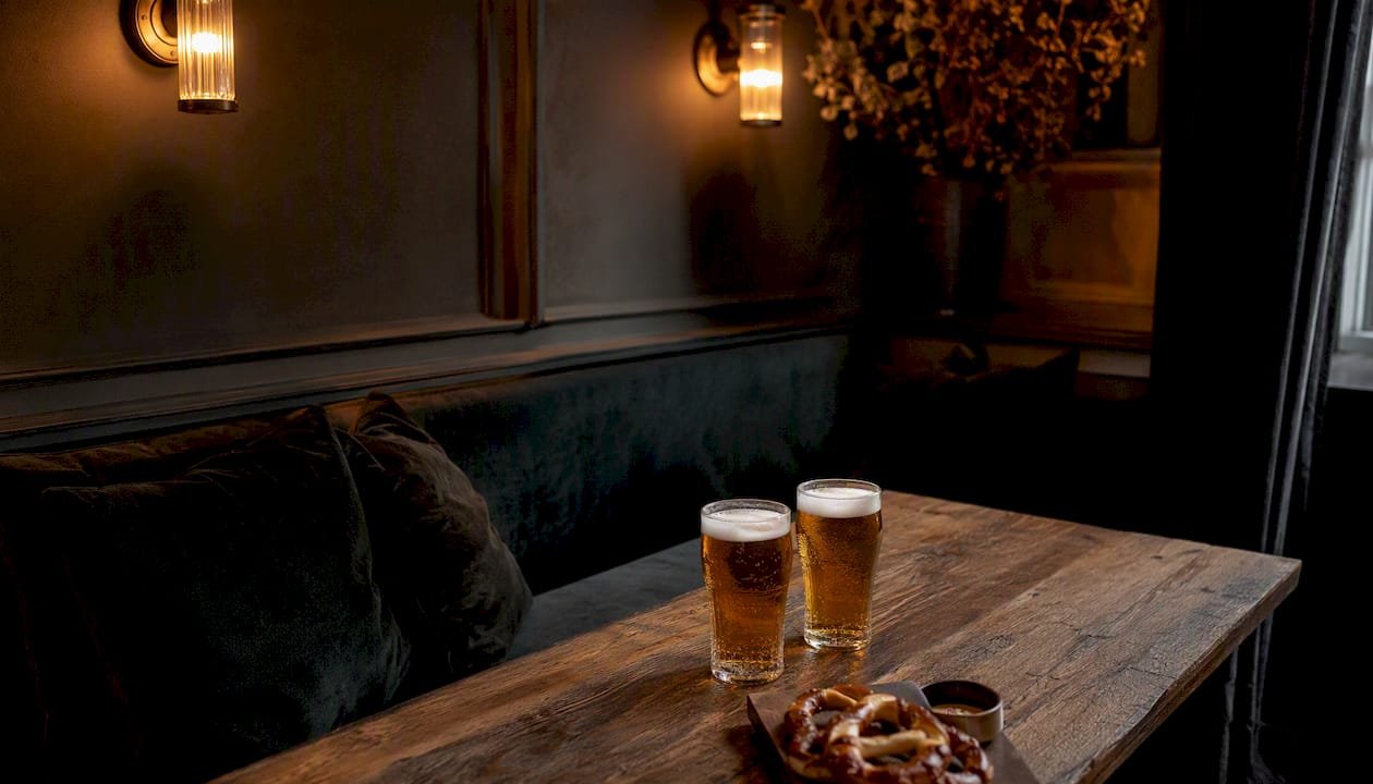 Small semi-private bar area with craft beer glasses